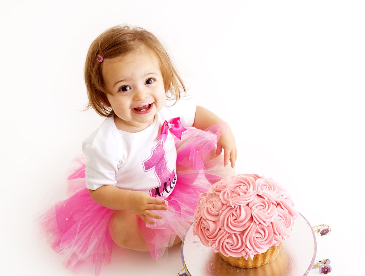 Baby girl first birthday cake smash portrait photography session