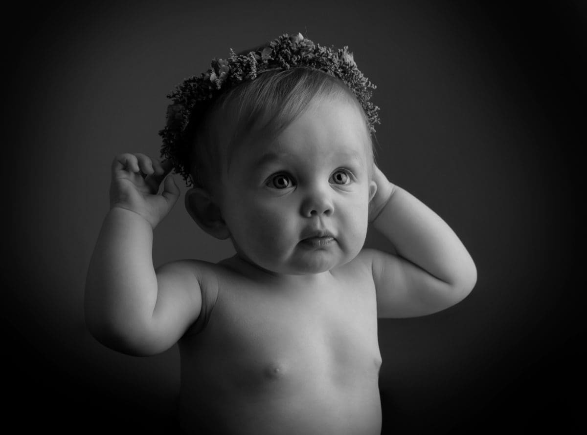 Beautiful baby photography portrait in black and white with baby wearing a crown of dries flowers