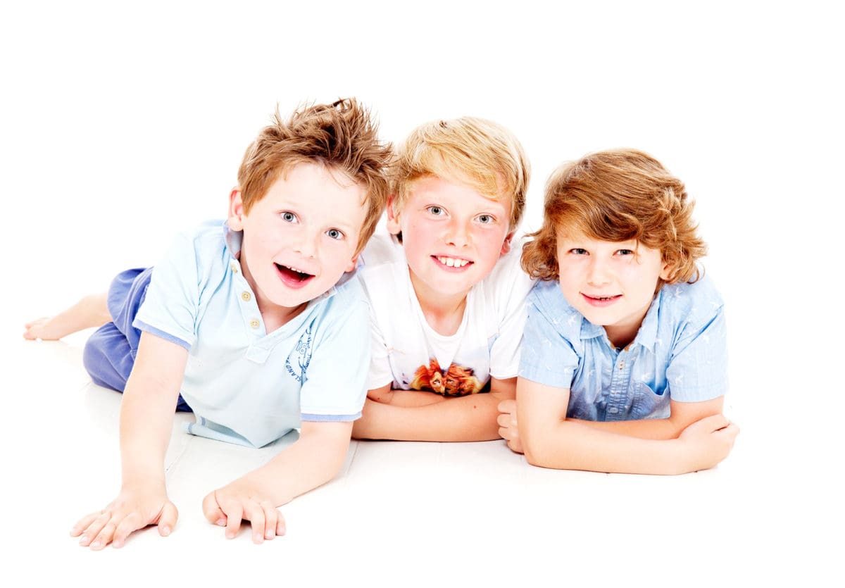 Informal group portrait of boys in photography studio photoshoot