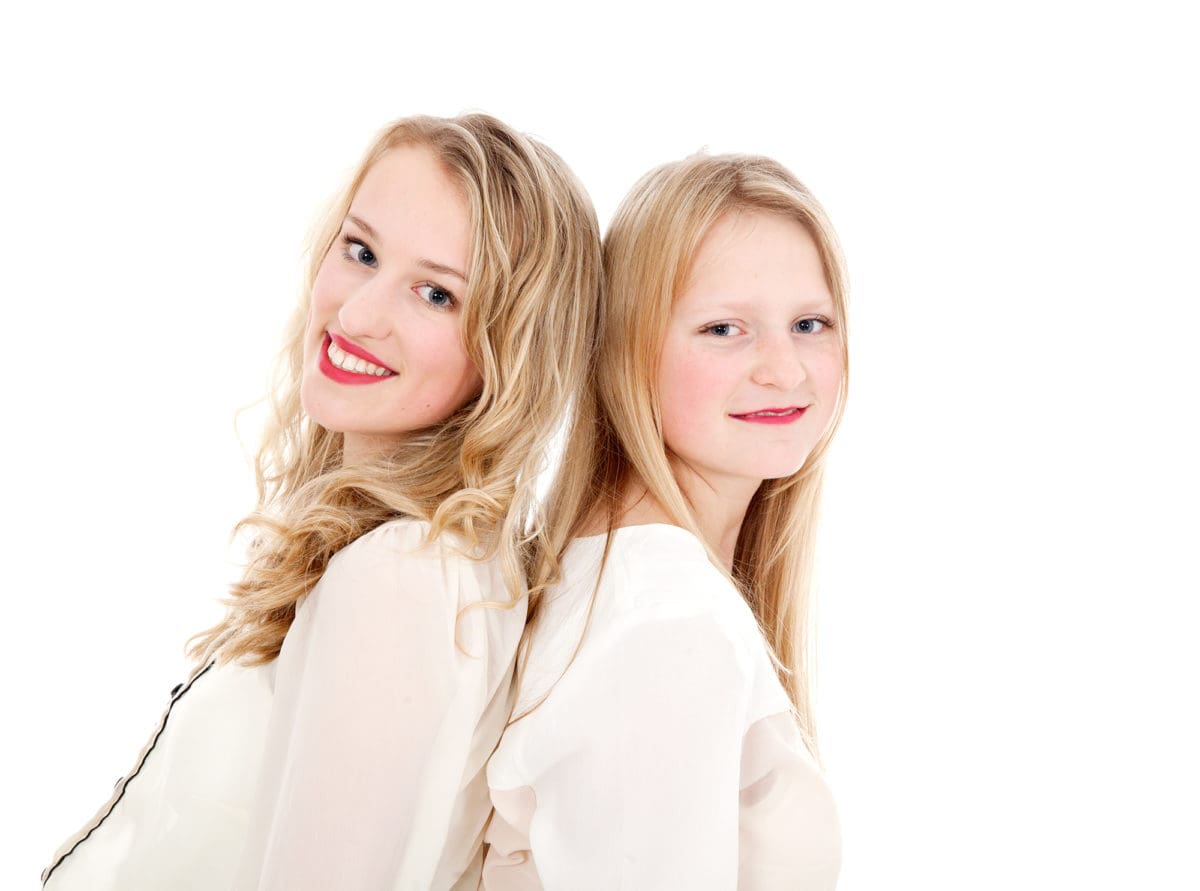 High key image of sisters from a professional children’s portrait photoshoot