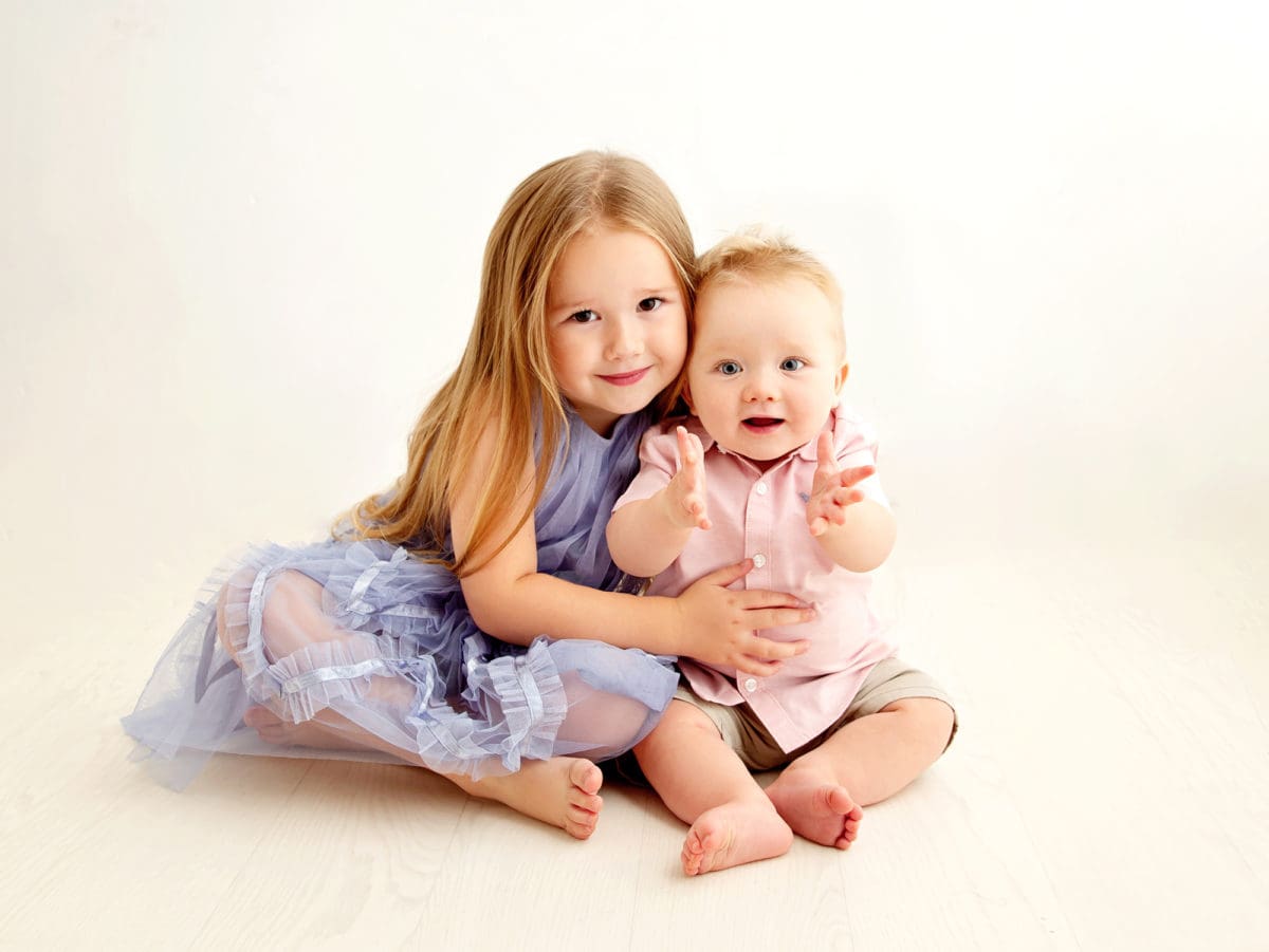 Professionally shot child’s portrait photograph of two young siblings