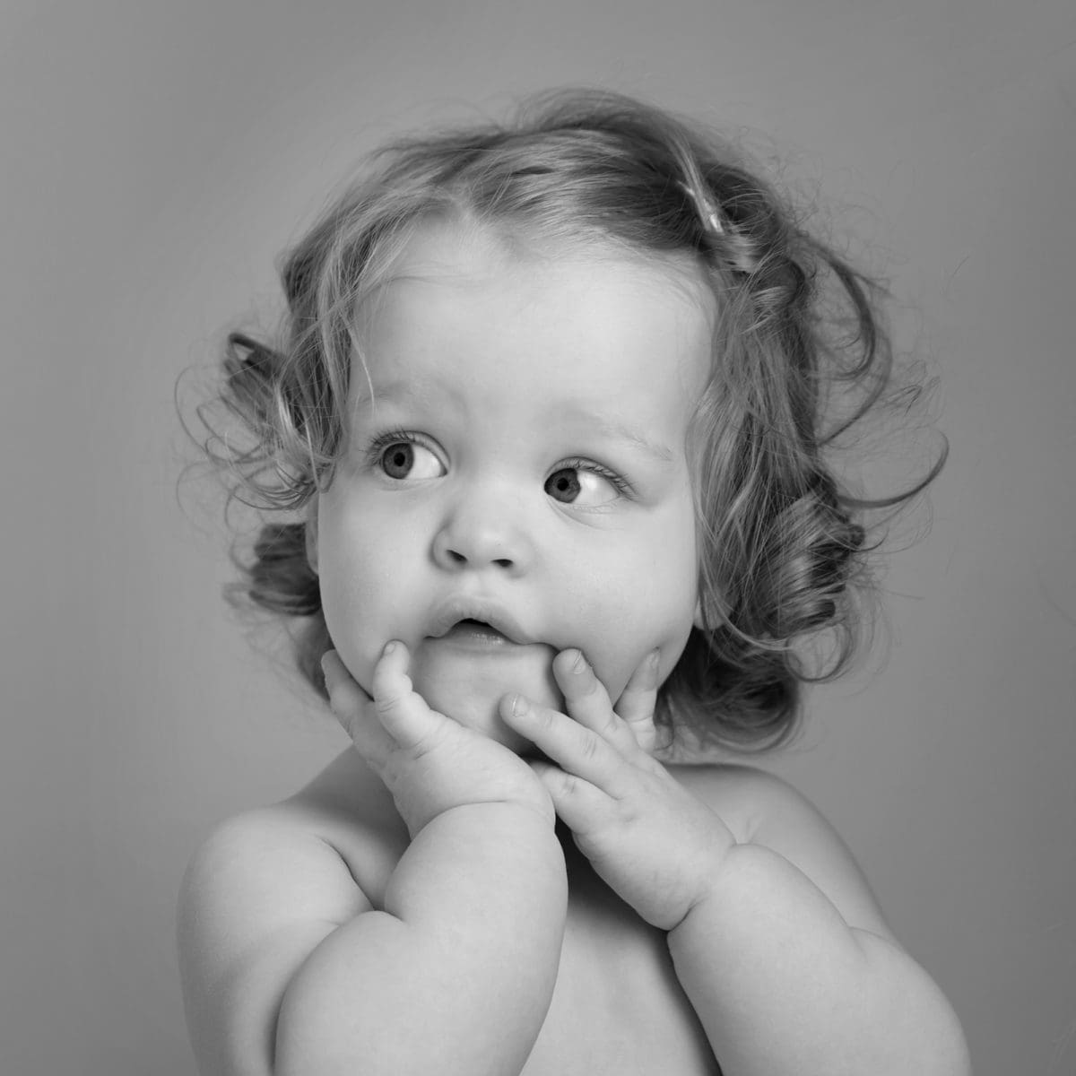 Black and white image from a children’s studio portrait photography session