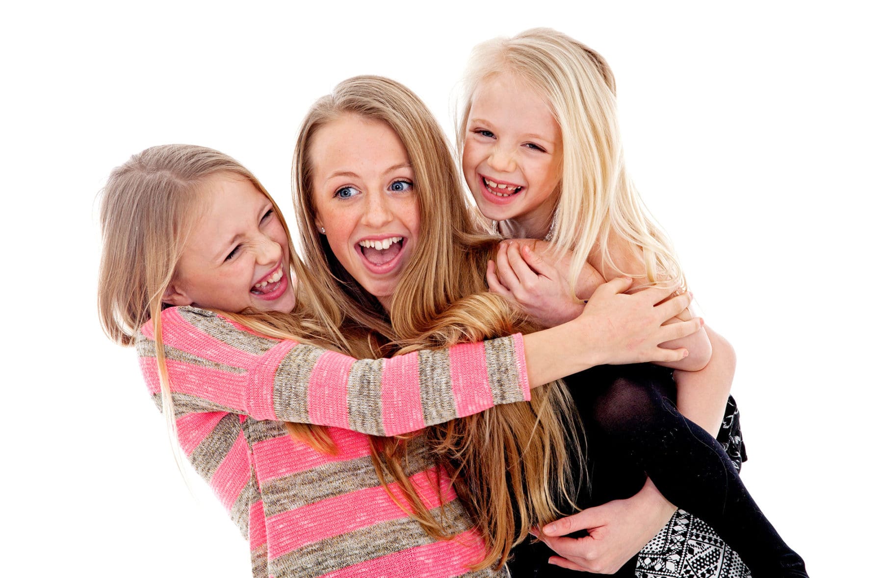 Full colour image of three sisters enjoying a children’s portrait photography session