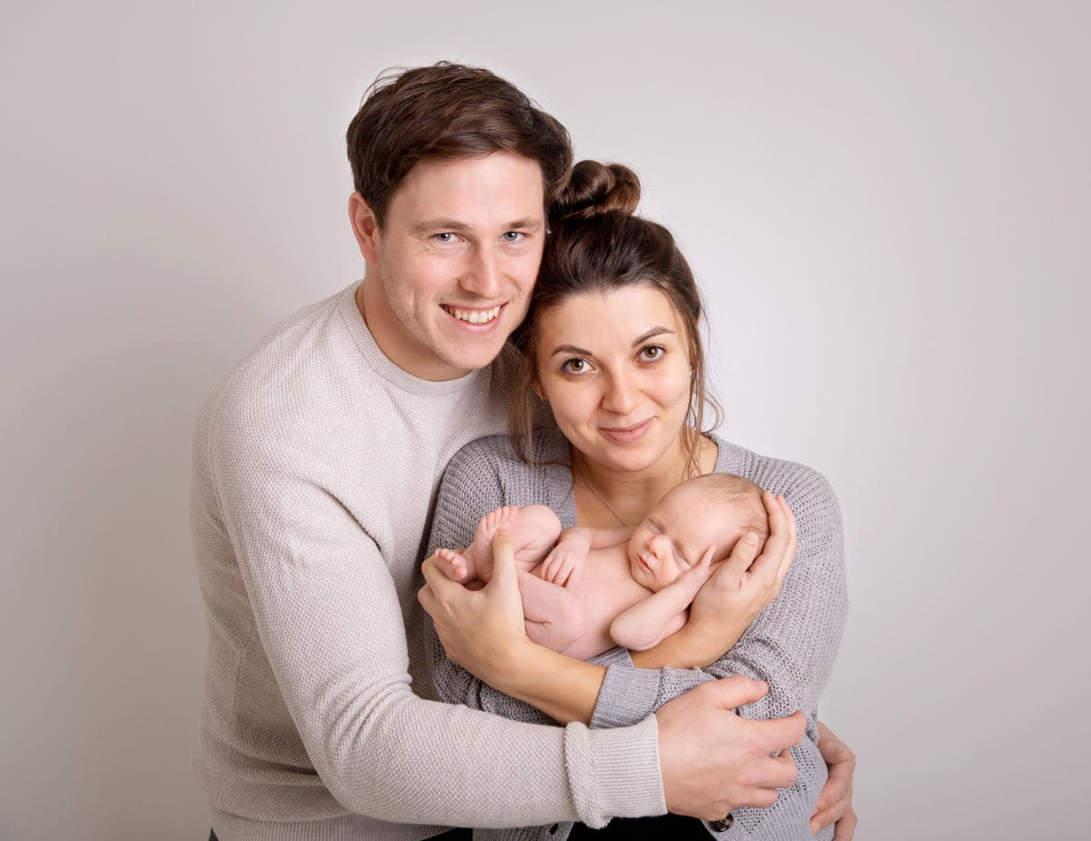 Portrait of a brand new family with baby