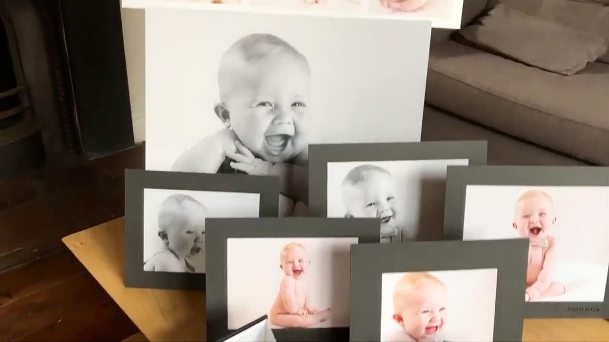 Video poster frame of mum collecting her picture order from a baby photoshoot at The Picture Box photography studio